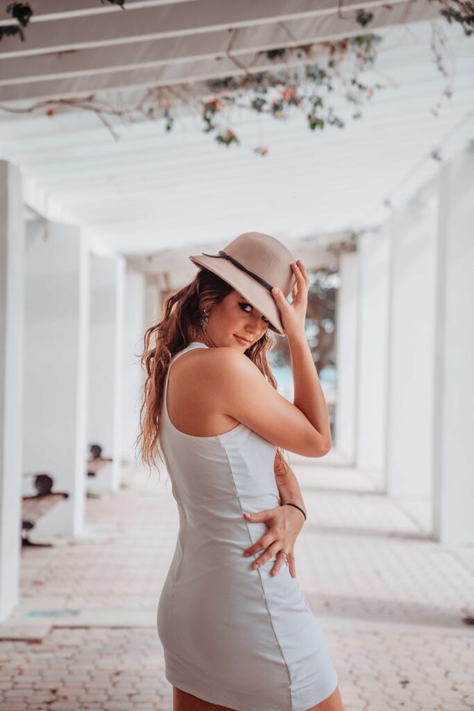 Aimee Albright in a white dress posing in North Straub Park in downtown st petersburg