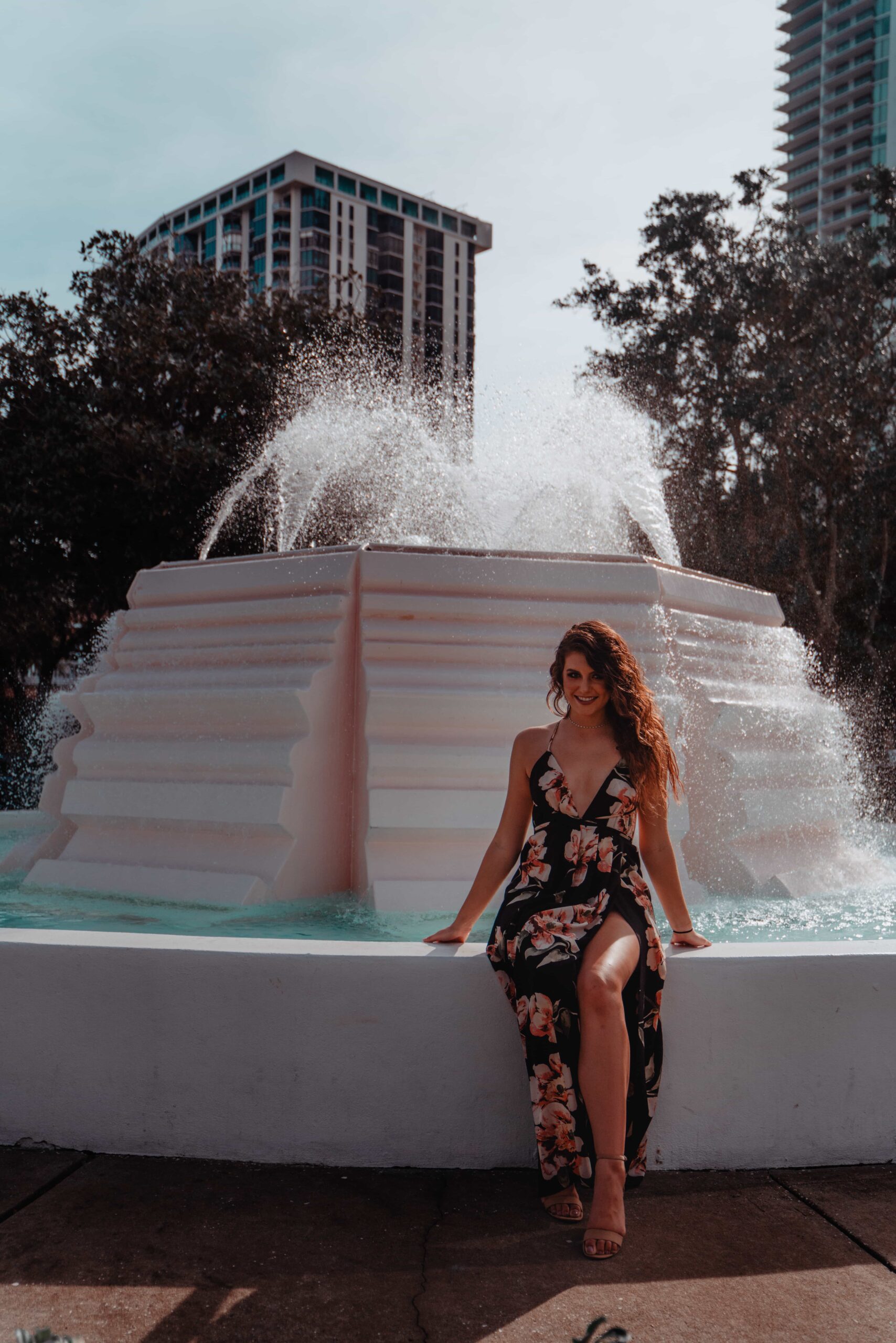 Aimee Albright wearig dress at the water fountain in south straub park st pete