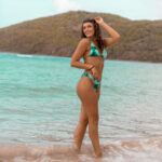 amazing aimee walking on beach in bikini with hands in her hair at Flamenco Beach, Culebra, Puerto Rico